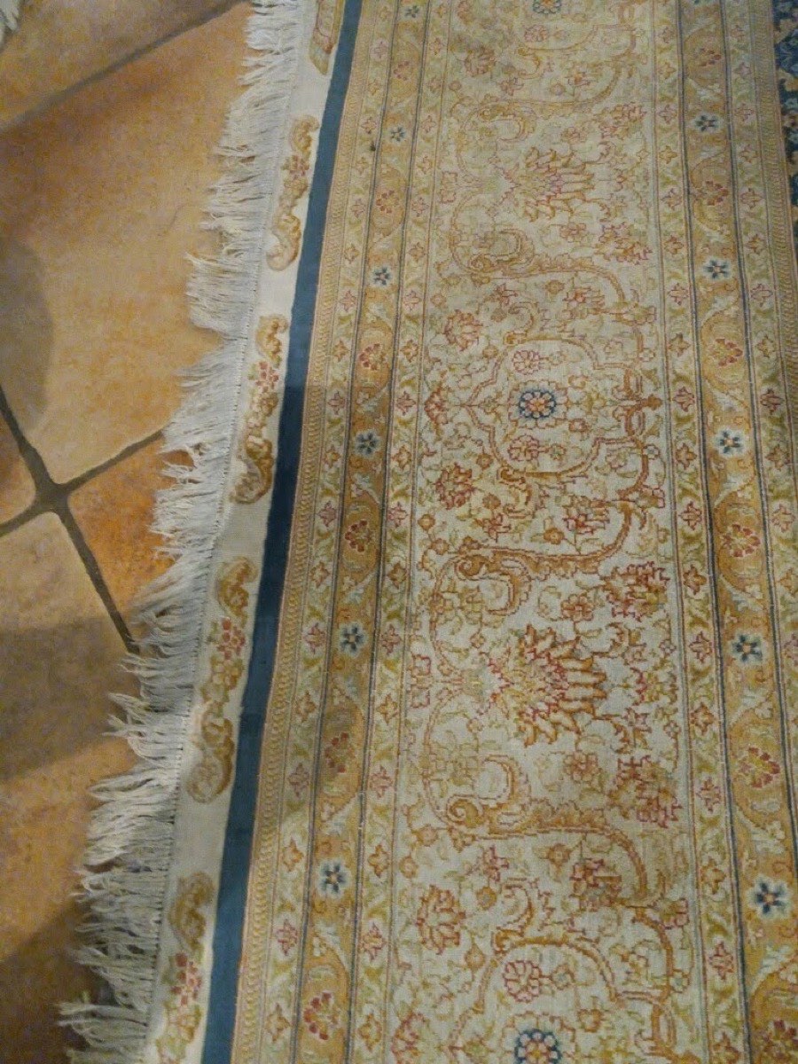 A patterned rug with fringe after cleaning