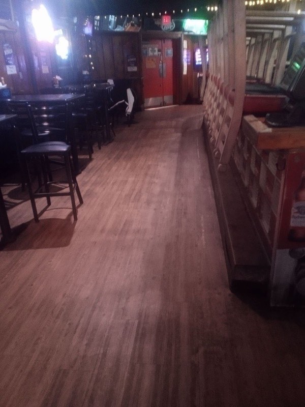 Clean wood-look floor at a bar